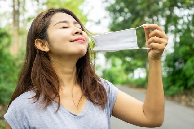 Premium Photo | Asian take off face mask and breath deep fresh air of nature