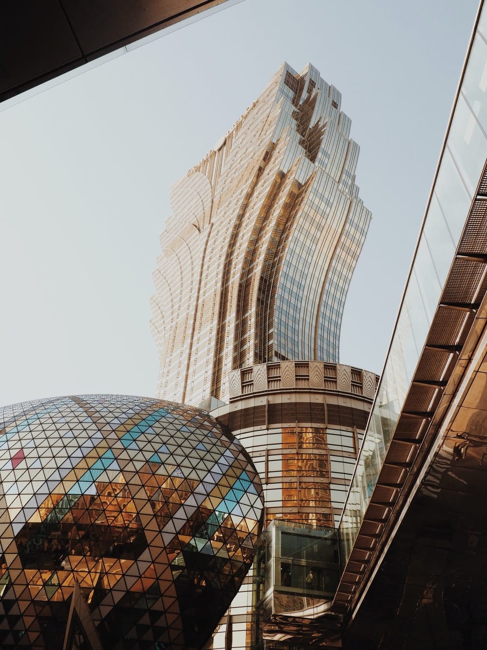 brown high-rise building under the blue sky during daytime